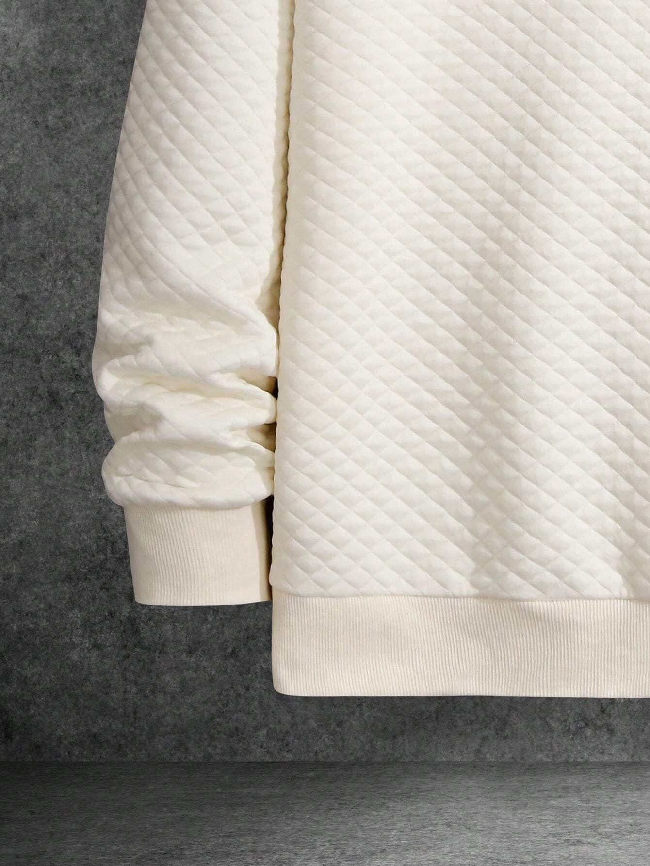 Apricot quilted long sleeve sweatshirt with drop shoulder and ribbed cuffs and hem.