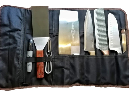 Set of knives in a black leather case on a white background