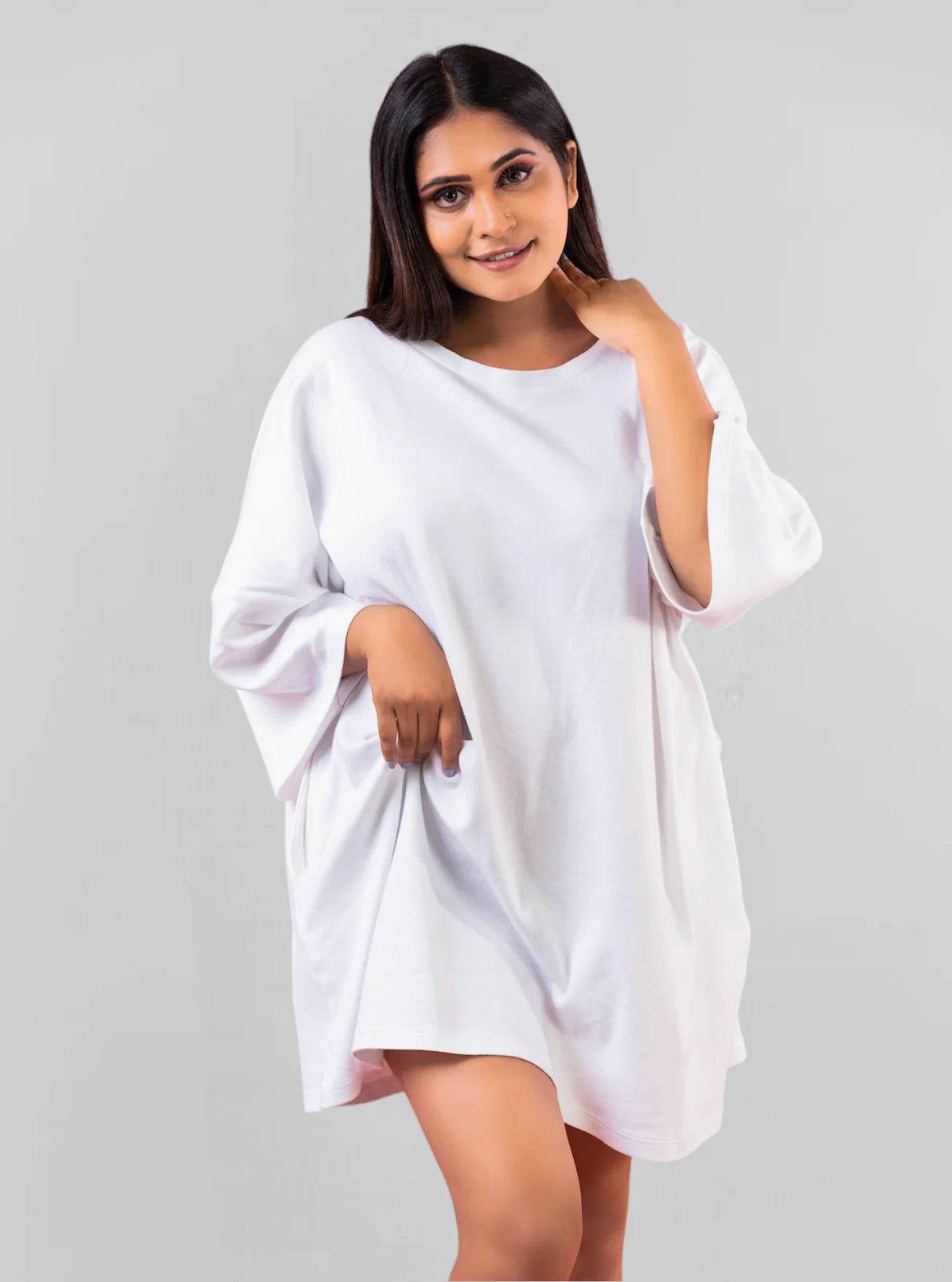 White relaxed fit oversized t-shirt with dropped shoulders and short sleeves worn by a woman.