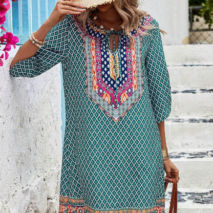 Blue casual sling dress with geometric and colorful ethnic print, three-quarter sleeves, and a relaxed fit.