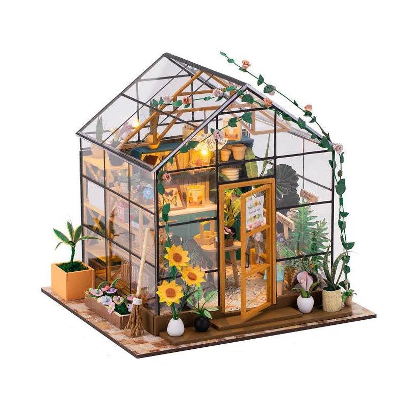 Mini DIY flower house dollhouse with glass walls, rooftop garden, sunflowers, and potted plants.