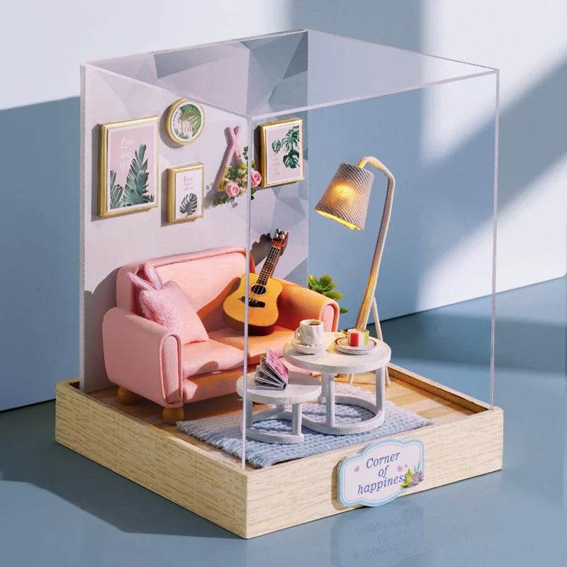 Miniature flower-themed dollhouse living room with pink sofa, guitar, round table, lamp, and framed wall art inside clear.