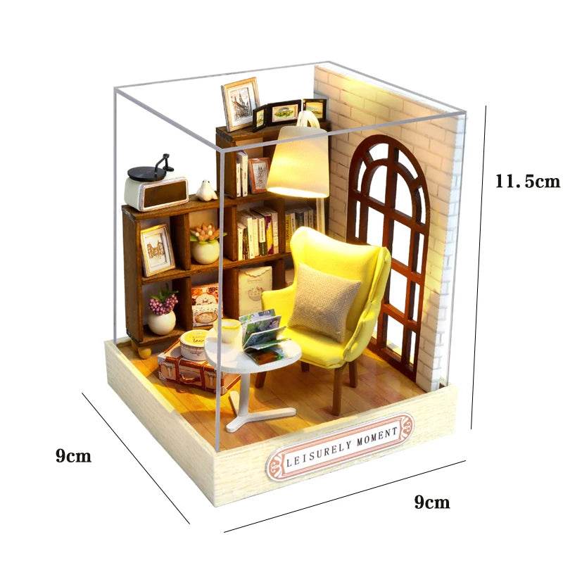 Miniature 3D flower house kit with yellow armchair, wooden bookshelf, floor lamp, and arched window in clear display box.