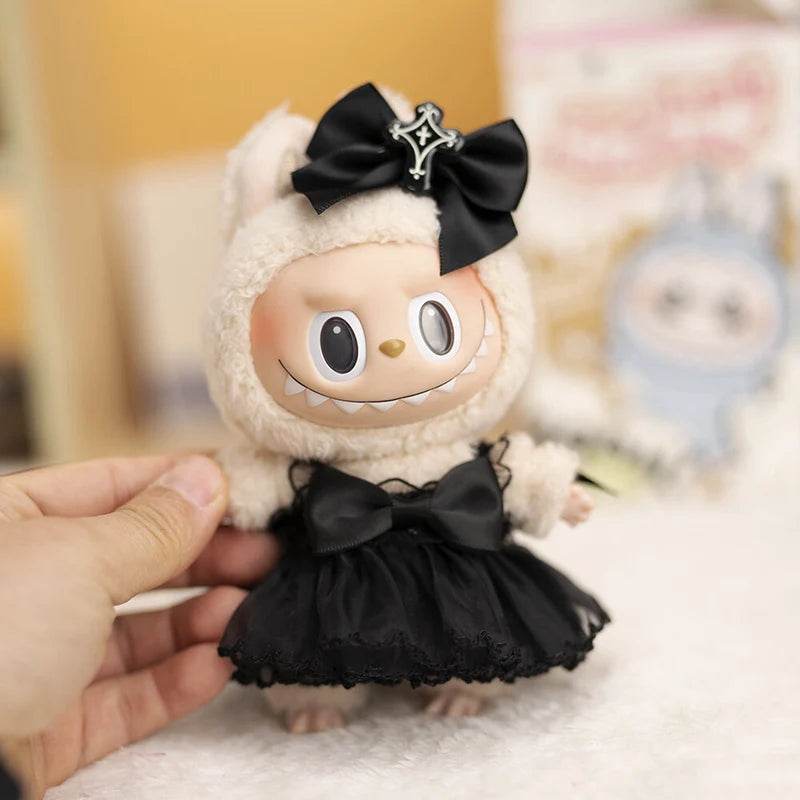 17cm doll wearing black devil-themed wedding dress with satin bow and horned hood.
