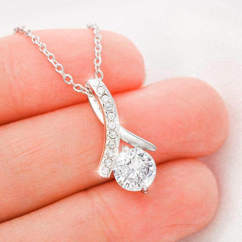 Silver pendant necklace with curved design and clear round crystals on silver chain.