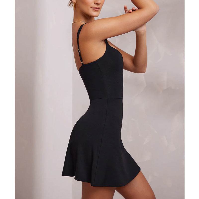 Black sleeveless spaghetti strap mini dress with flared hem and backless design.