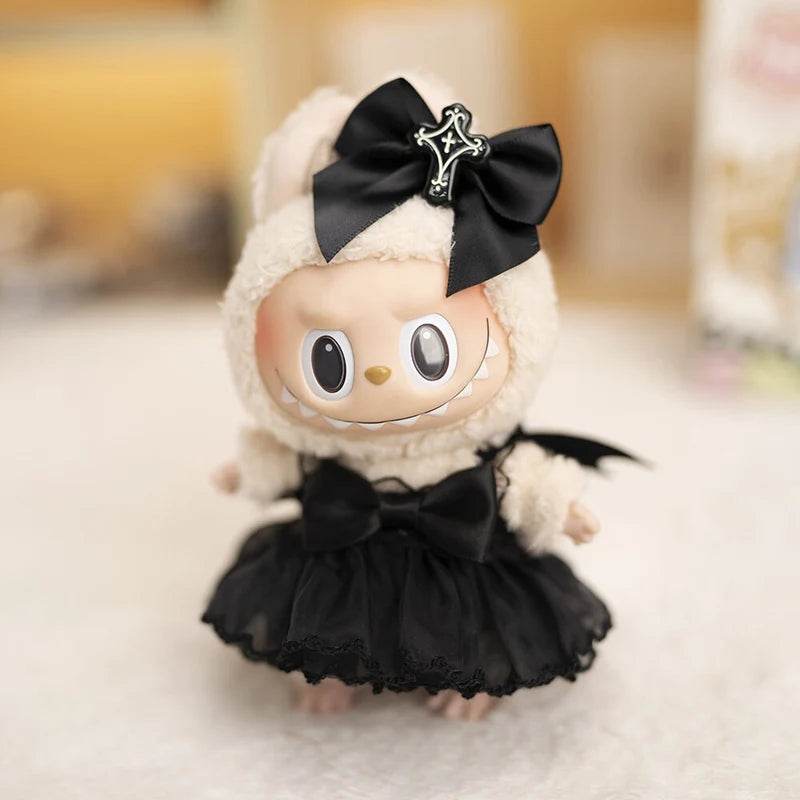 17cm doll wearing a black devil wedding dress with bat wings and a black bow headband.