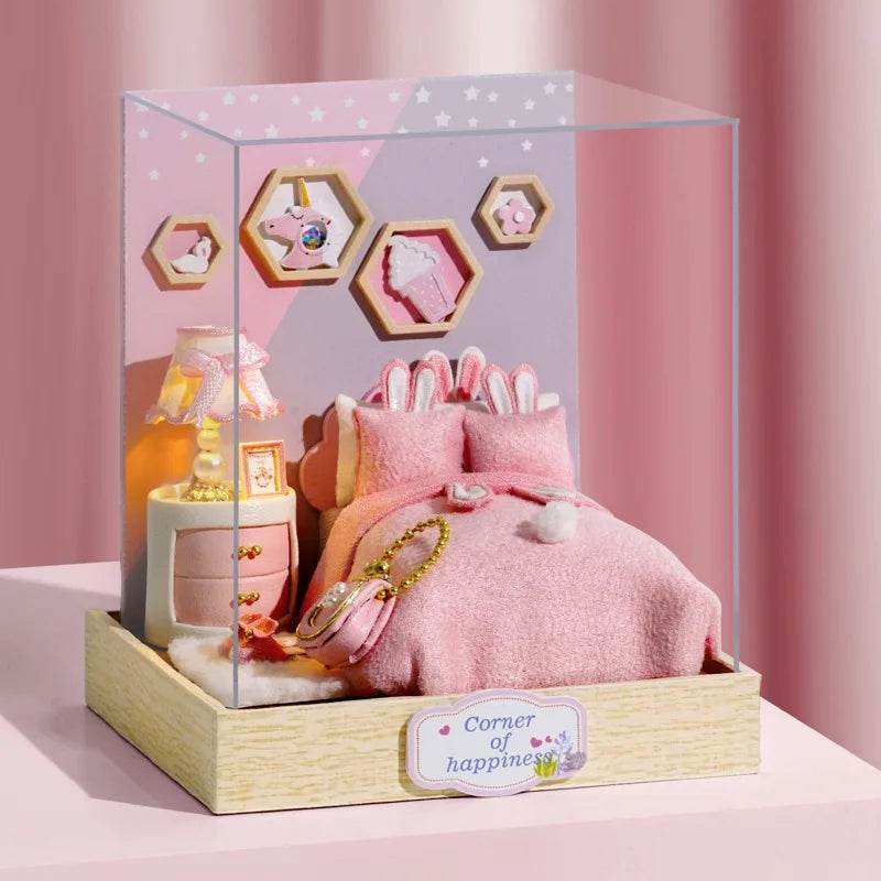 Miniature pink-themed dollhouse bedroom with a cozy bed, stuffed bunny, wooden bedside table, lamp, and hexagonal wall.