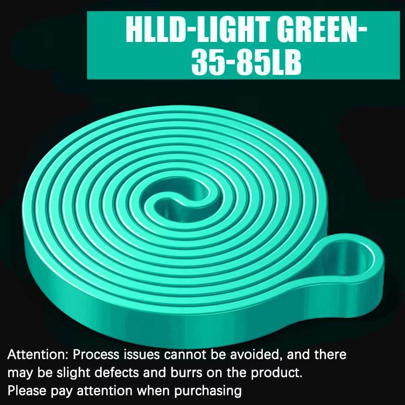 Light green resistance band coiled flat with looped end, labeled 35-85 lb tension range.