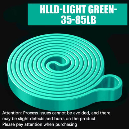 Light green resistance band coiled flat with looped end, labeled 35-85 lb tension range.