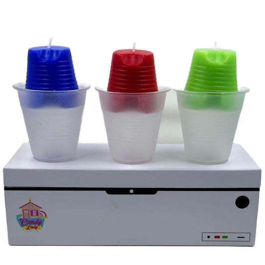 Set of three Huckabuck candles in blue, red, and green, each in a clear plastic cup, on a white box with a colorful logo.