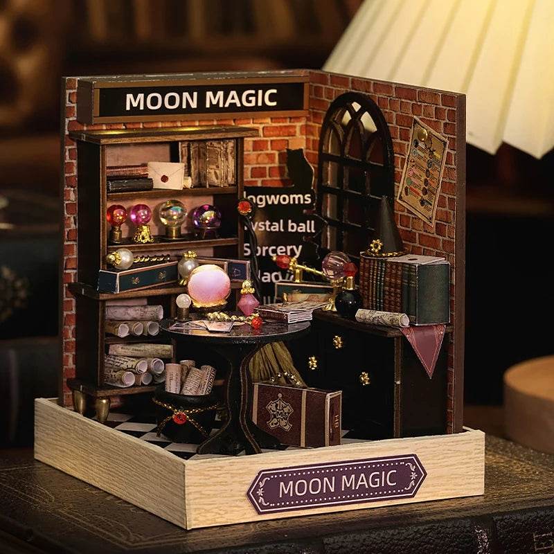 Miniature 3D dollhouse room with brick walls, arched window, mystical decor, and wooden base labeled Moon Magic.