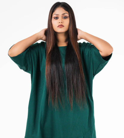 Dark green relaxed fit t-shirt with dropped shoulders worn by model with long straight hair.