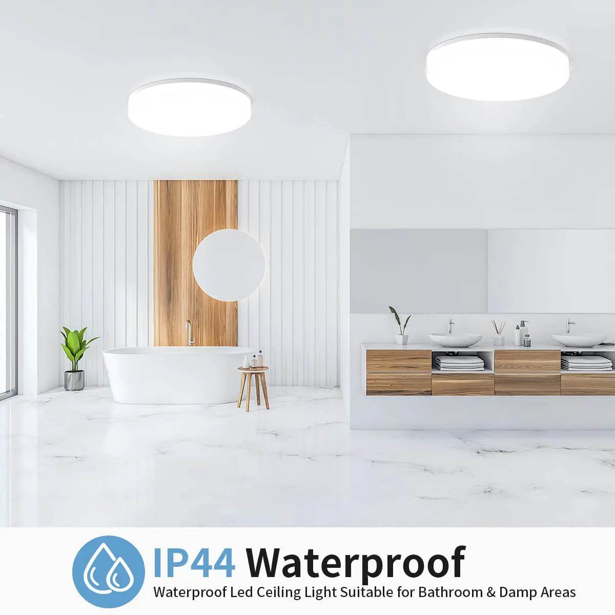 Two modern round LED ceiling lights with bright white illumination in a minimalist white bathroom and kitchen setting.