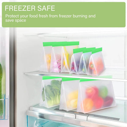Set of six translucent purple reusable freezer bags with green ziplock seals, filled with various colorful foods, arranged.
