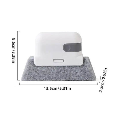 Compact white handheld groove cleaning brush with gray microfiber base, 13.5 cm wide and 8.6 cm tall.
