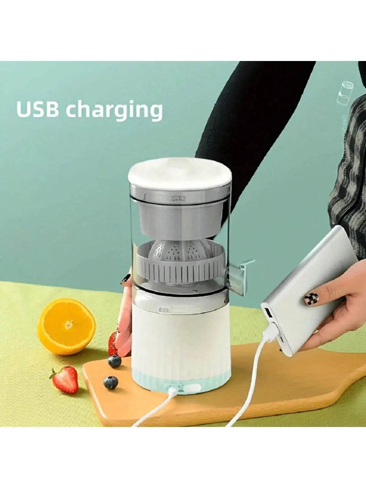 Compact white portable juicer with transparent pulp separator and USB charging cable plugged in.