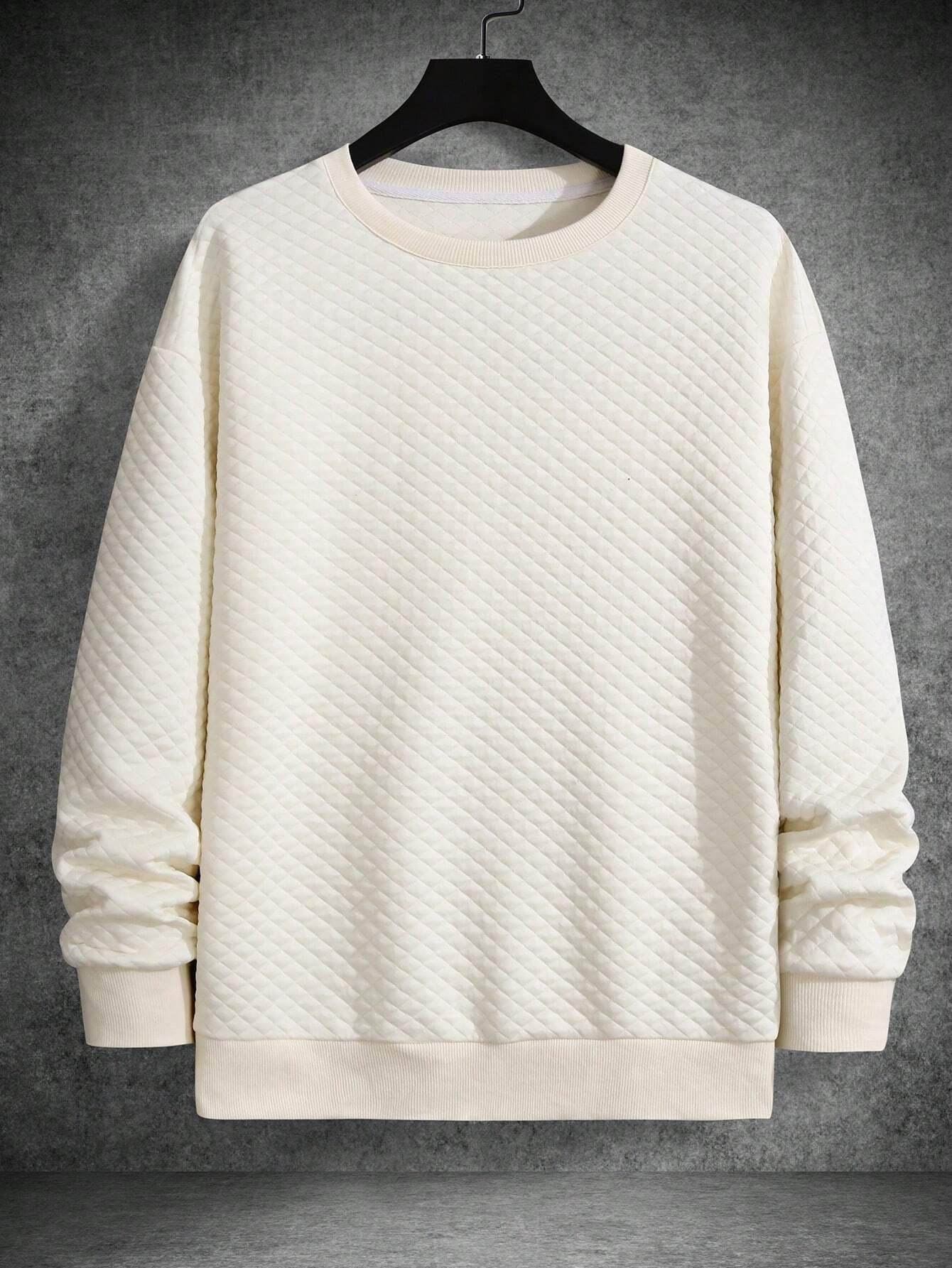 Apricot quilted long sleeve sweatshirt with drop shoulders and ribbed cuffs and hem.