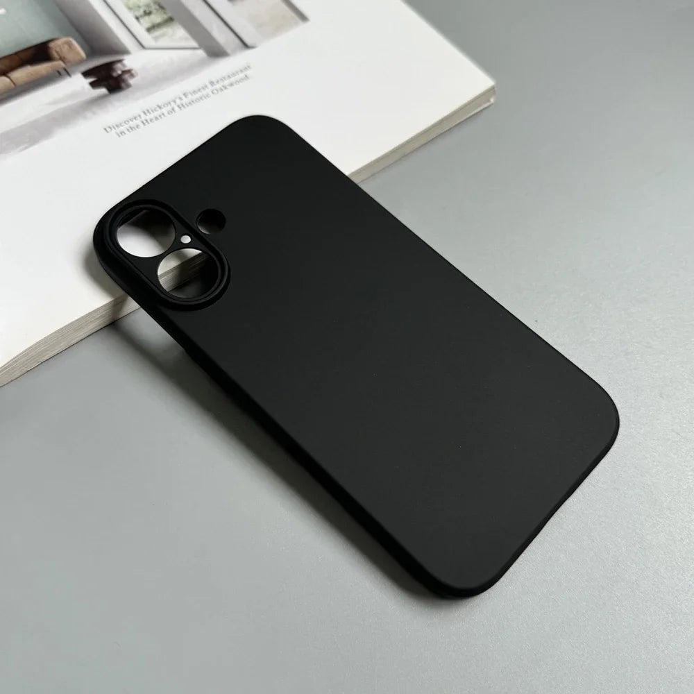 Black phone case on a light gray surface with a magazine in the background