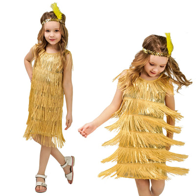 Two children wearing gold fringe dresses with headbands on a white background