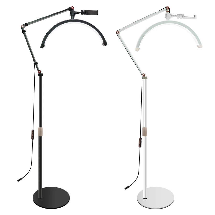 Two adjustable floor lamps, one black and one white, on a white background.