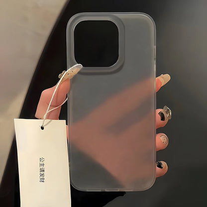 Clear phone case held by a hand with a blurred background