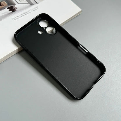 Black phone case on a gray surface with a magazine underneath