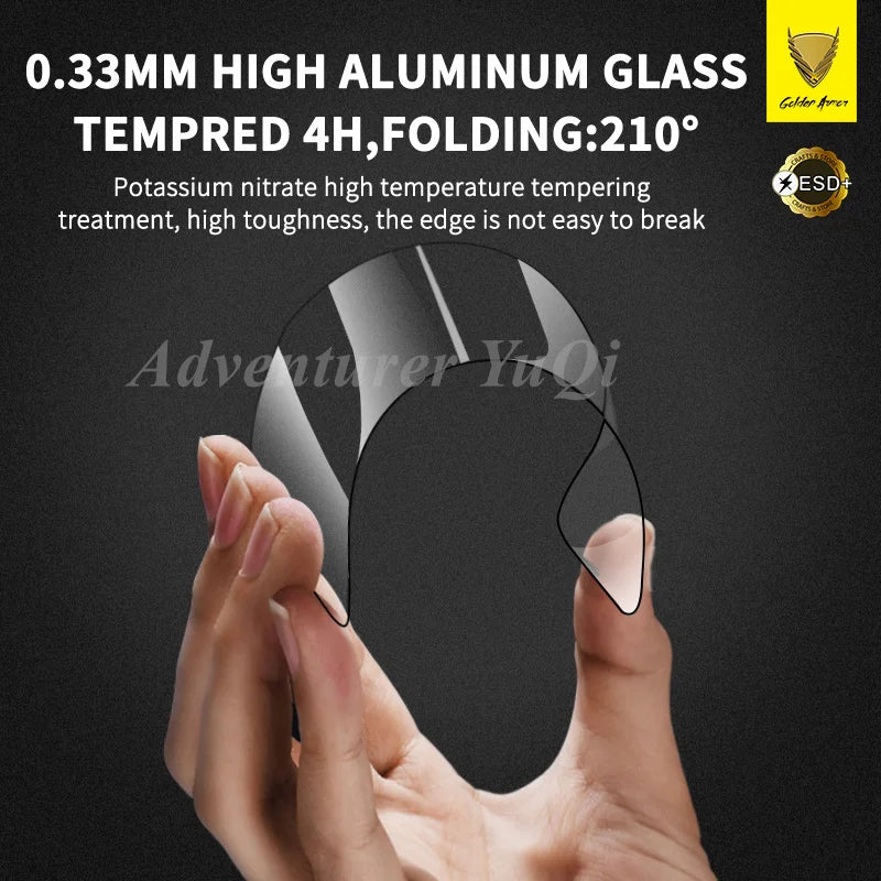 Hand holding a black tempered glass screen protector with text about its features on a dark background.