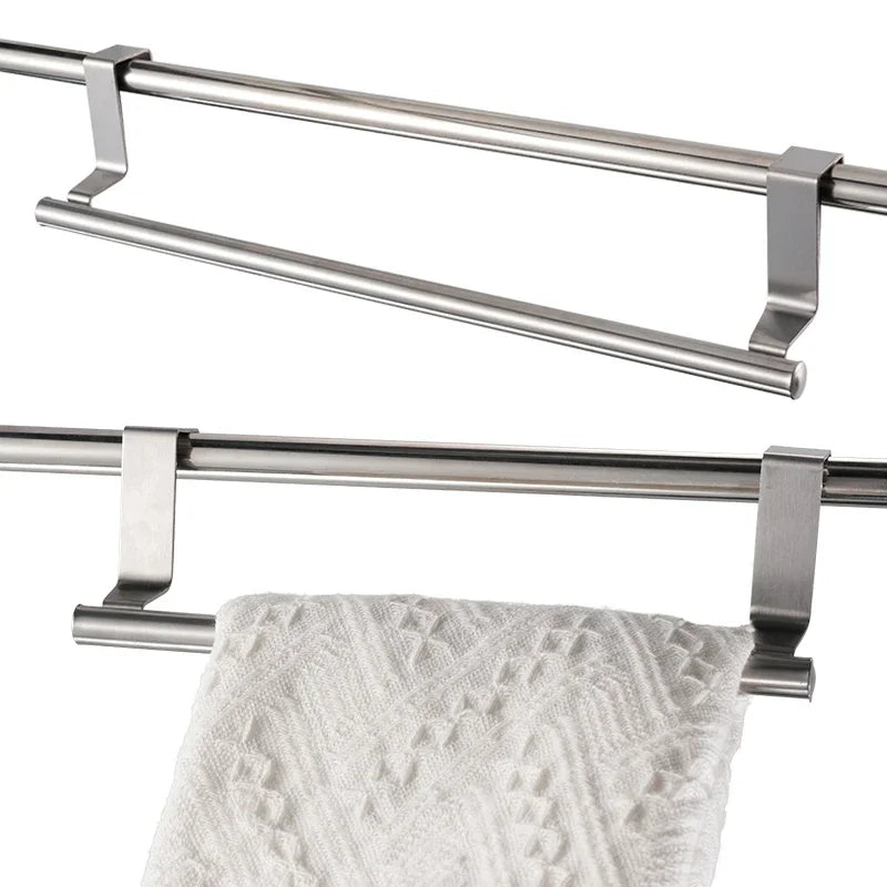 Double towel bar with a white towel hanging on it against a white background