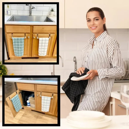 Woman in a kitchen with cabinets and sink, using a dishcloth.