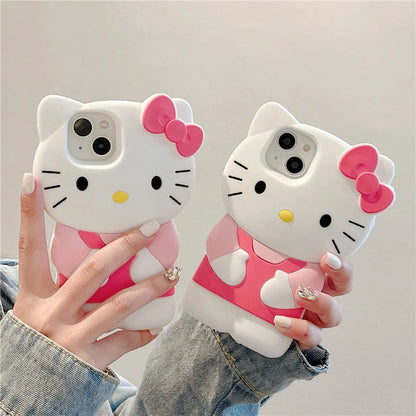 Two Hello Kitty phone cases held by a person against a neutral background