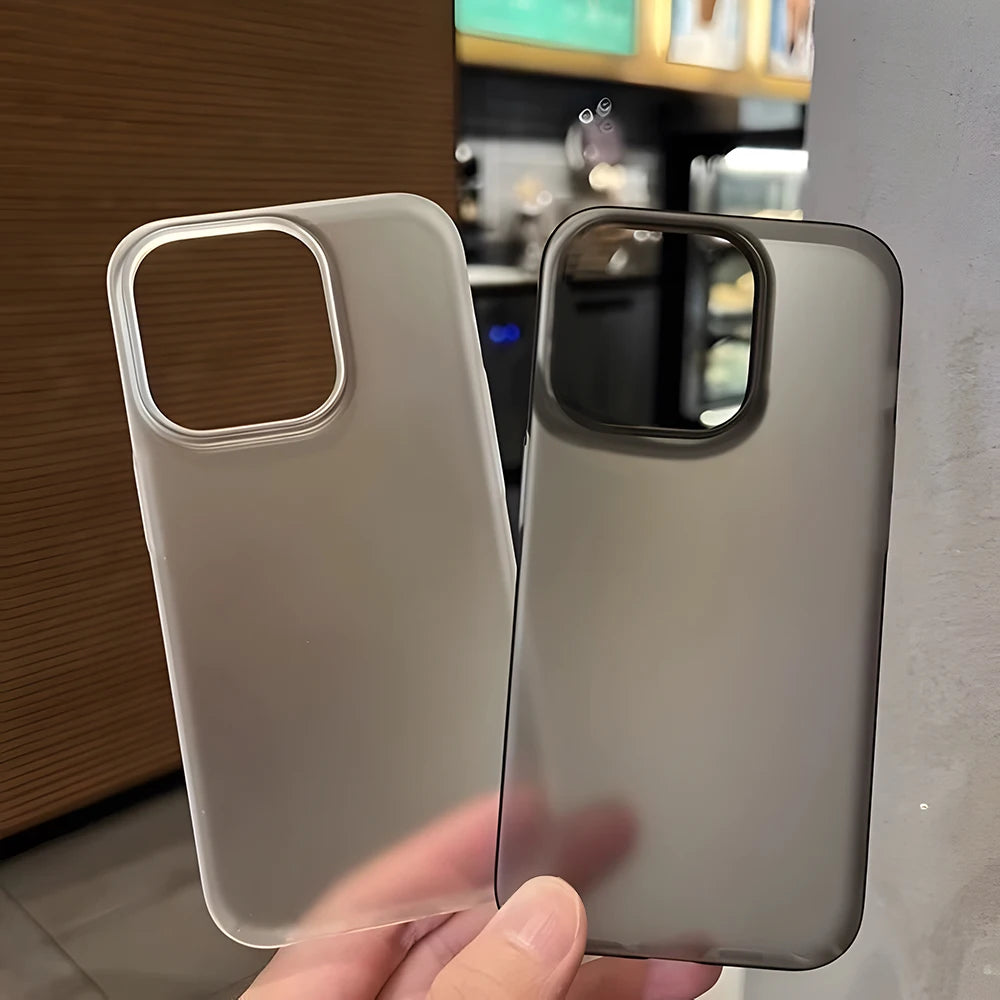 Two phone cases held side by side with a blurred indoor background
