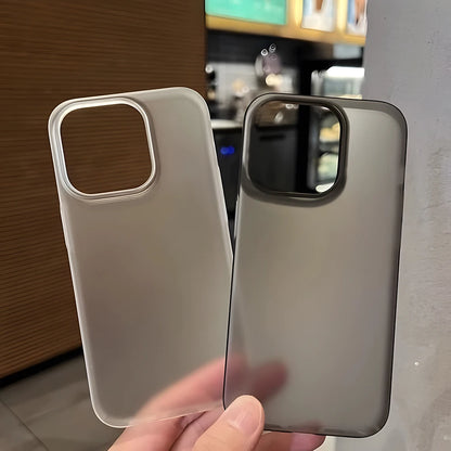 Two phone cases held side by side with a blurred indoor background