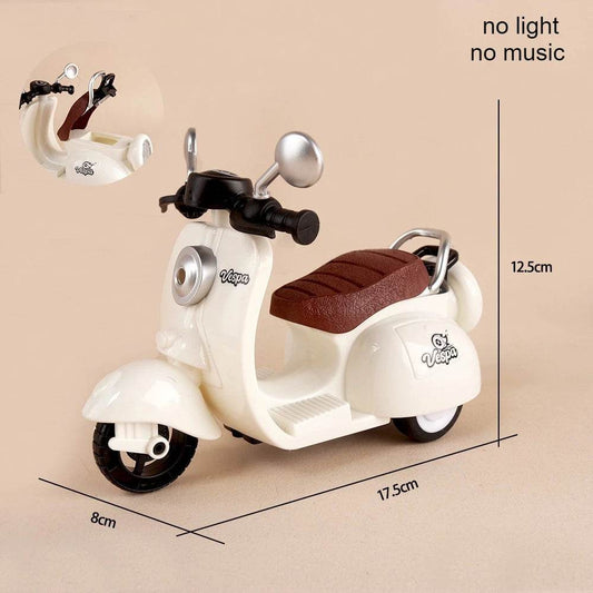 Beige mini electric motorcycle toy with brown quilted seat and silver mirrors, 17.5cm long.