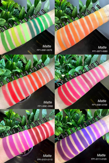 Six open eyeshadow palettes with vibrant matte shades in green, orange, red, pink, magenta, and purple tones, displayed with .