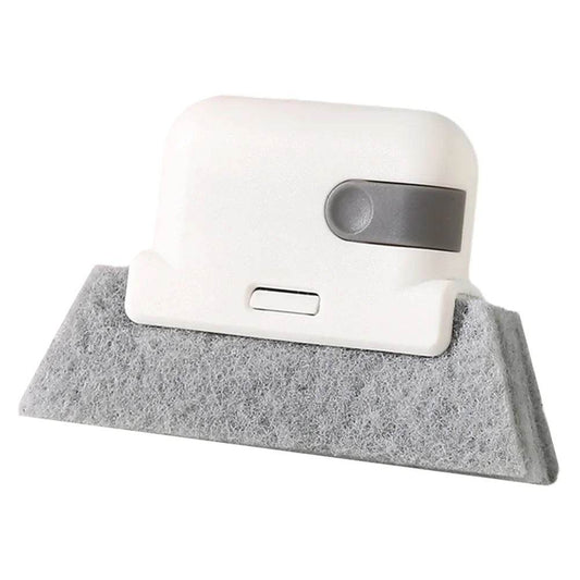White handheld crevice cleaning tool with gray felt base for window and door grooves.