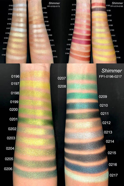 Arm swatches of highly pigmented matte and shimmer eyeshadows in neutral and vibrant tones on fair to deep skin.