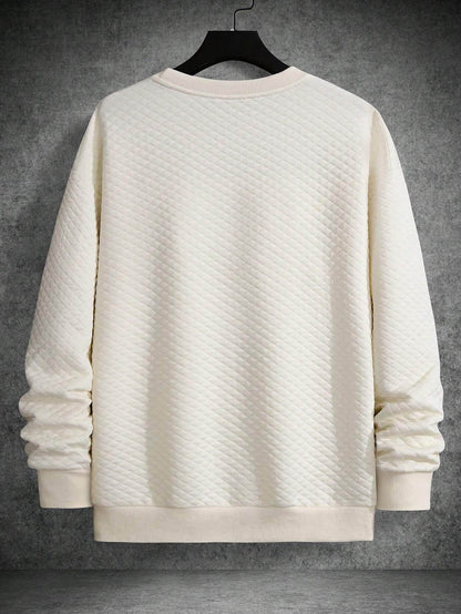 Apricot textured long sleeve sweatshirt with drop shoulders and ribbed cuffs and hem.