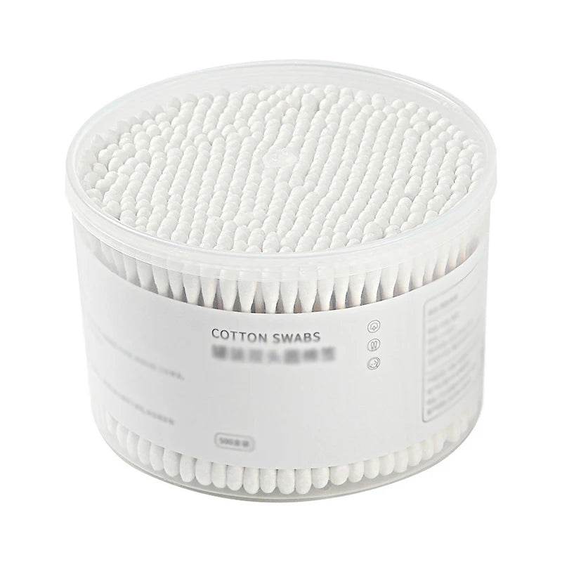 Clear round plastic container filled with 500 double-ended white cotton swabs.