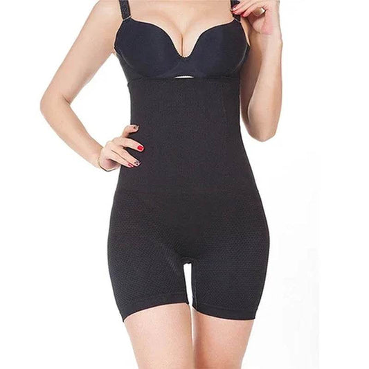 Black high waist compression tummy and thigh control shapewear shorts on model with adjustable straps.