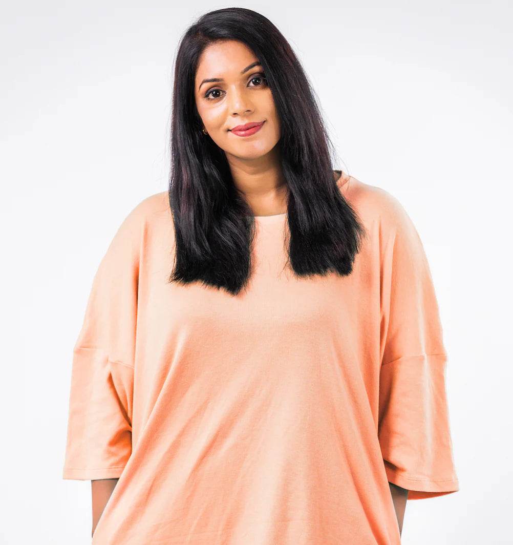 Relaxed fit t-shirt in soft peach with dropped shoulders and elbow-length sleeves.