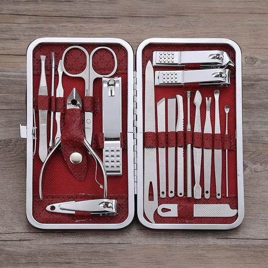 Black travel grooming kit with 19 stainless steel manicure and pedicure tools in a leather case.
