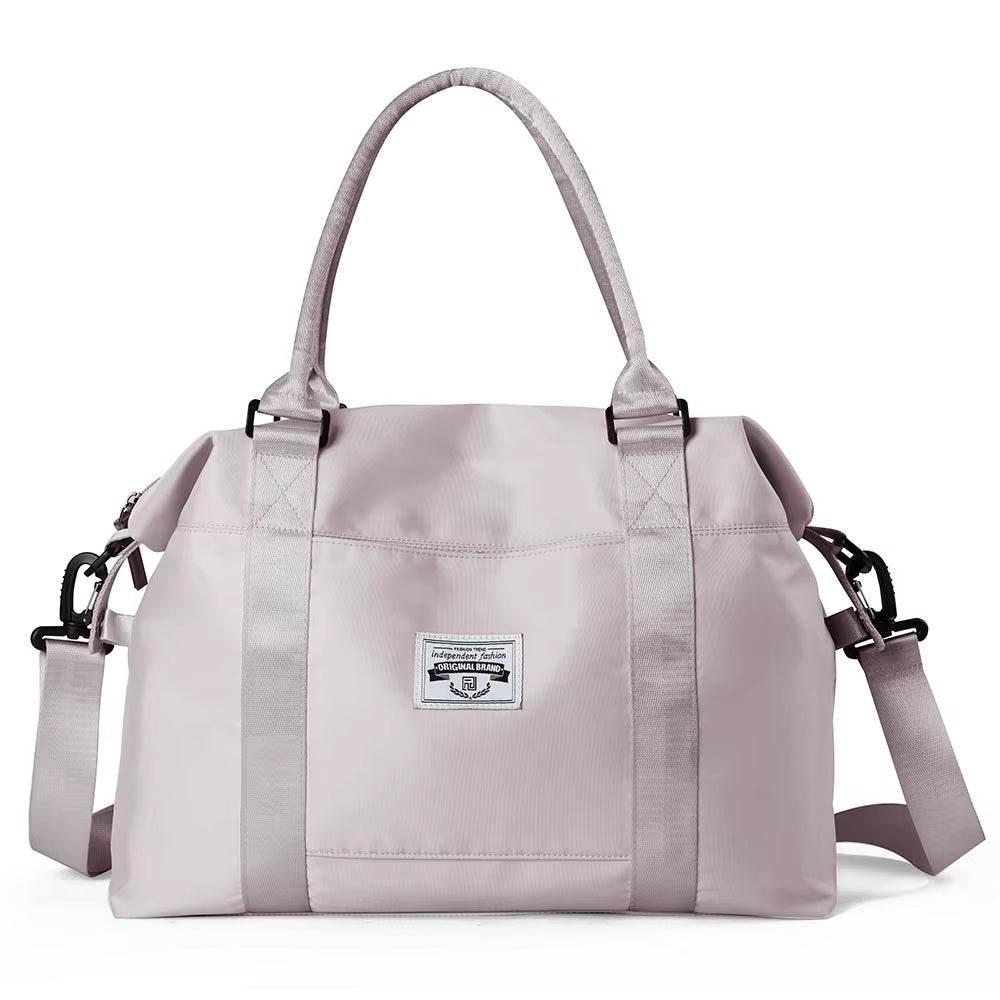Light purple waterproof duffel bag with dual handles and adjustable shoulder strap, rectangular shape with front logo patch.