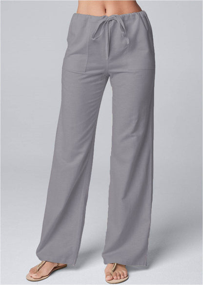Light gray loose-fit cotton linen pants with lace-up waist and straight legs.