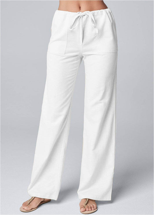 White loose-fit straight-leg pants with lace-up waistband in cotton and linen blend.