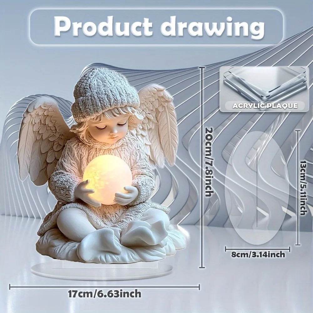 White angel figurine with wings and knit hat holding glowing orb on round pedestal.