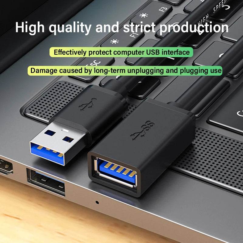 Black USB 3.0 extension cable with blue connector inside, male to female plugged into laptop USB ports.