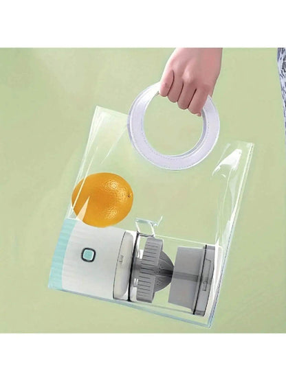 Compact white portable juicer with gray lid and transparent body held by hand with round handle.