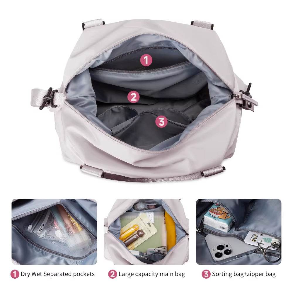 Light gray waterproof duffel bag with open compartment showing multiple internal pockets and zipper compartments.